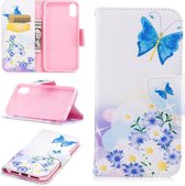 Blauwe vlinders en bloemen iPhone X portemonnee hoesje