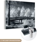 MuchoWow® Glasschilderij 80x60 cm - Schilderij acrylglas - Winter - Almere - Sneeuw - Foto op glas - Schilderijen