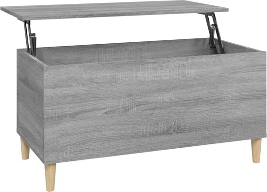 Grijze salontafel met houtnerf en opklapbaar blad, op houten pootjes.