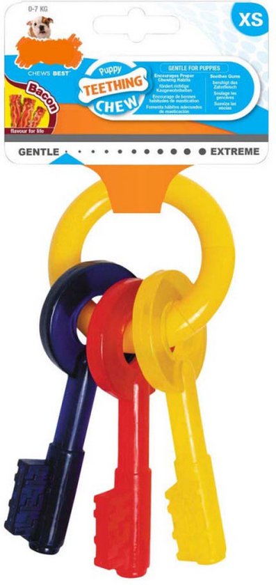 Verpakking met gele, rode en blauwe sleutel speeltjes, met 'Puppy Teething Chew' en 'Bacon flavour'.