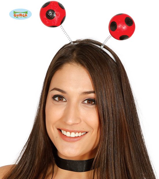 Diadeem met twee rode lieveheersbeestjes met zwarte stippen op een zilveren veer.