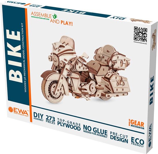 Doos van een houten 3D-bouwmodel van een motorfiets met tekst "Assemble and Play! Bike Wooden 3D Mechanical Model Construction Kit DIY 273 Top-Grade Plywood No Glue Needed Pre-Cut Design Eco Friendly Gear Mechanism".