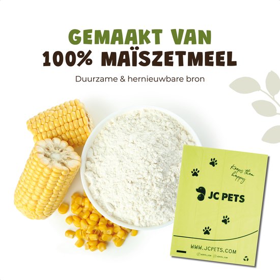 Maïskorrels, maïsmeel en een groen JC Pets poepzakje met pootafdrukken, dat de biologische afbreekbaarheid benadrukt.