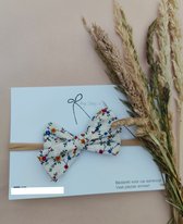 Haarband witte strik met vrolijke bloemenprint