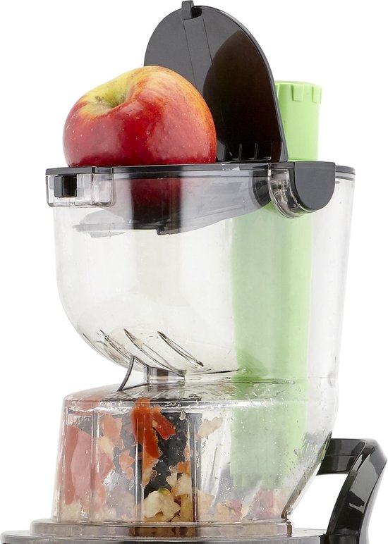 Close-up van Princess slowjuicer met een rode appel in de opening.