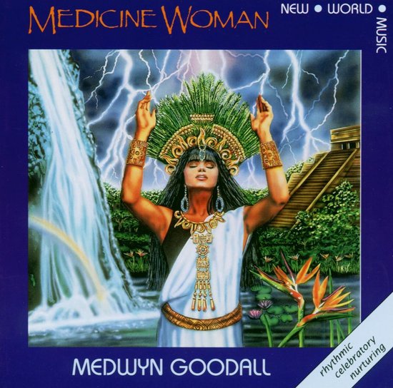Een vrouw met een groen hoofddeksel, gouden sieraden, met opgestoken handen voor een waterval en een piramide. Tekst: MEDICINE WOMAN.