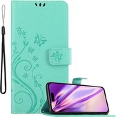 Cadorabo Hoesje geschikt voor Apple iPhone 14 PRO in BLOEMEN TURKOOIS - Beschermhoes in bloemmotief met magnetische sluiting, standfunctie en kaartsleuven Book Case Cover Etui