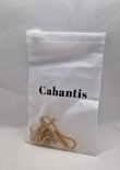 Gouden kruisketting met kruis en dikke schakel, in een doorzichtig plastic zakje met "Cabantis" logo.