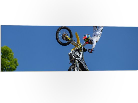 WallClassics - PVC Schuimplaat- Freestyle Motocross boven Boom - 90x30 cm Foto op PVC Schuimplaat