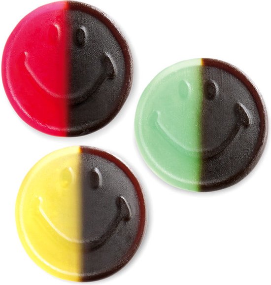 Drie ronde snoepjes met lachende gezichtjes in rood/zwart, geel/zwart en groen/zwart.