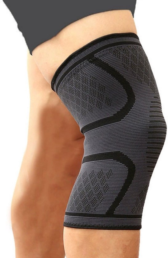 Genouillère grise avec des accents noirs et un motif en losange, portée sur une jambe.