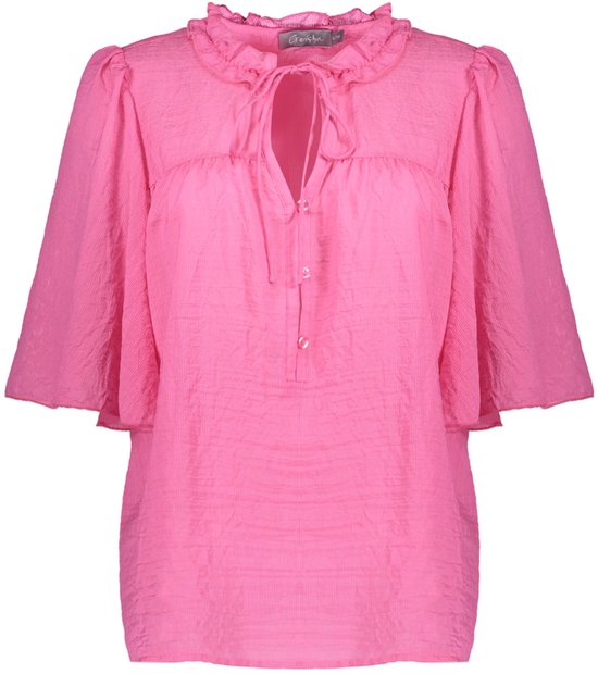 Blouse Geisha rose avec col à volants, détail à nœud et manches évasées.