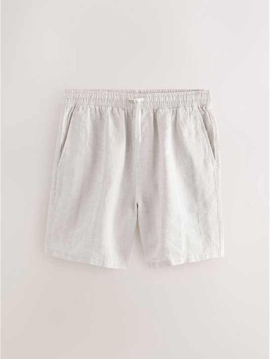 Lichtbeige linnen short met verticale strepen, elastische tailleband en trekkoord.