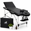 Zwarte inklapbare massagetafel met hoofdsteun, armleuningen, gezichtsgat, tas en accessoires.