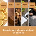 Collage van houtproducten: snijplanken met citroen, slagersblok, houten keukengerei, roestvrij staal en leisteen.