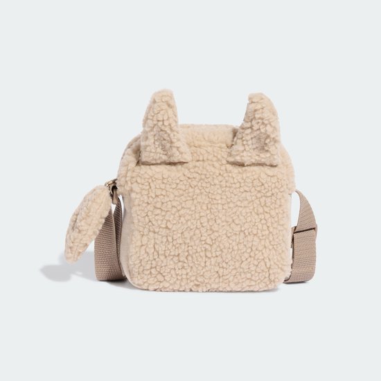 Beige teddy tasje in de vorm van een schaapje, zijaanzicht.