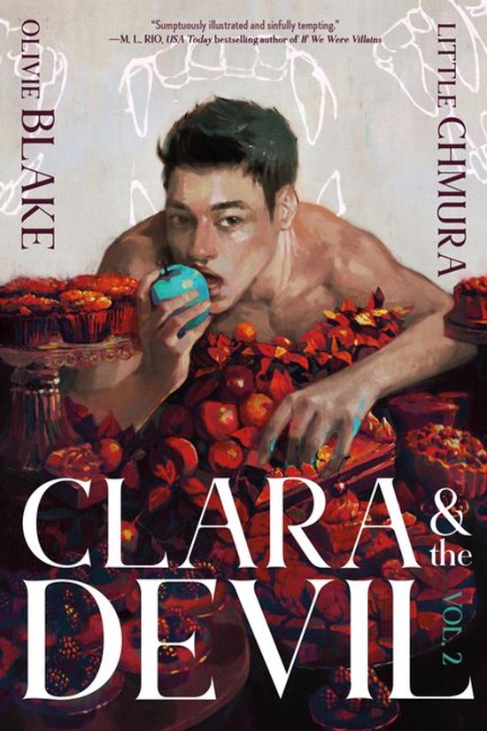 Jongeman in een tafel vol taartjes, appelen en bladeren, met een appel in zijn hand. Titel: Clara & the Devil, Vol. 2.