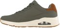 Olijfgroene sneaker met crèmekleurige zool, bruine hiel en luchtdemping.