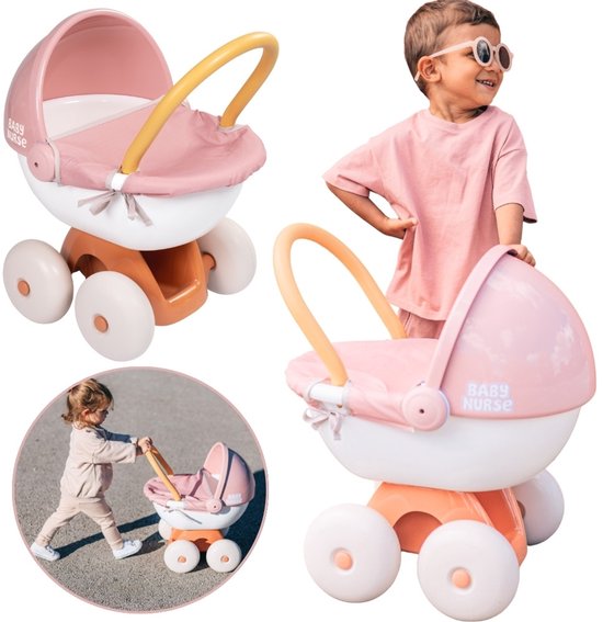 Une fille pousse une poussette rose et blanche. Petite image d'une fille poussant une poussette.