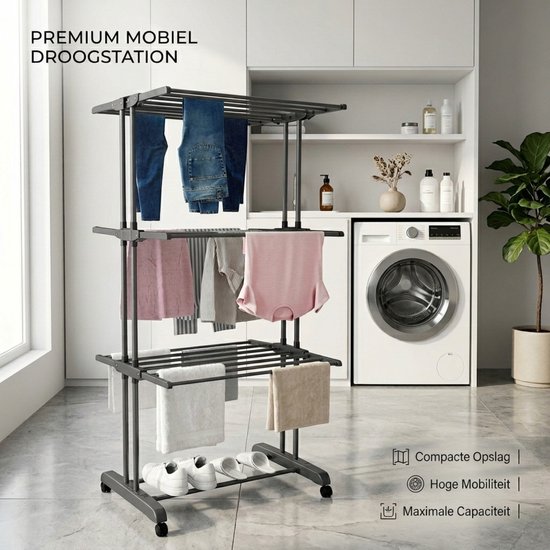 Donkergrijs kledingrek met 3 lagen, met op de bovenste laag jeans, middelste laag shirts en onderkant met handdoeken en schoenen. Tekst: "PREMIUM MOBIEL DROOGSTATION".