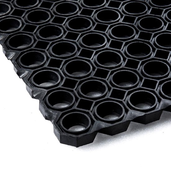 Tapis noir avec une structure ouverte en nid d'abeille.