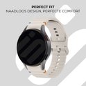 Smartwatch met crèmekleurig siliconen bandje met golvend patroon en gesp sluiting.