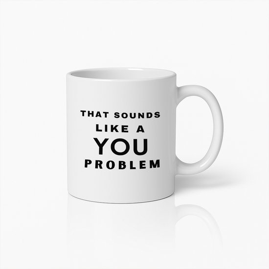 Tasse blanche avec le texte 'THAT SOUNDS LIKE A YOU PROBLEM' en lettres noires.