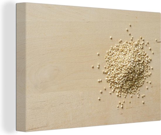 Canvas Schilderij Een stapel quinoa op een houten snijplank - 120x80 cm - Wanddecoratie