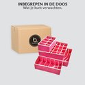 Een gesloten kartonnen doos met Buxibo logo en vier roze opbergdozen met vakken ernaast.