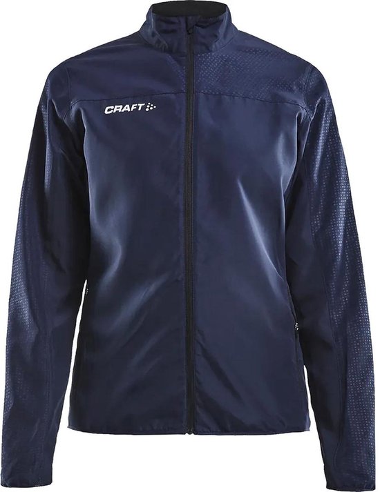 Veste coupe-vent Craft bleu marine avec un subtil imprimé en losanges sur les épaules et les manches.