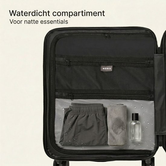 Binnenzijde van een donkerblauwe koffer met waterdicht compartiment voor natte kleding en toiletartikelen.