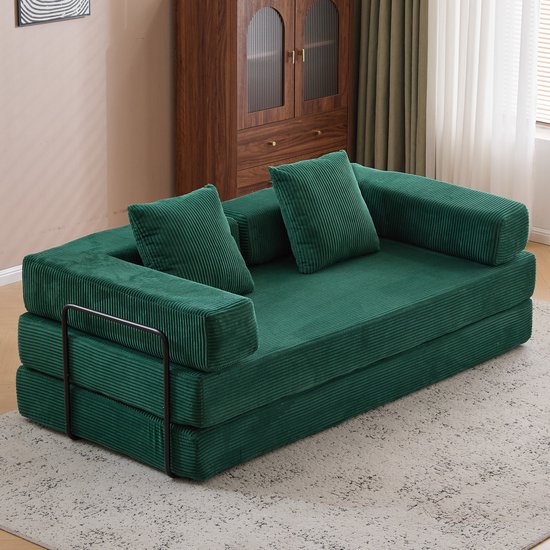 Donkergroene corduroy slaapbank met metalen frame, in zijaanzicht.