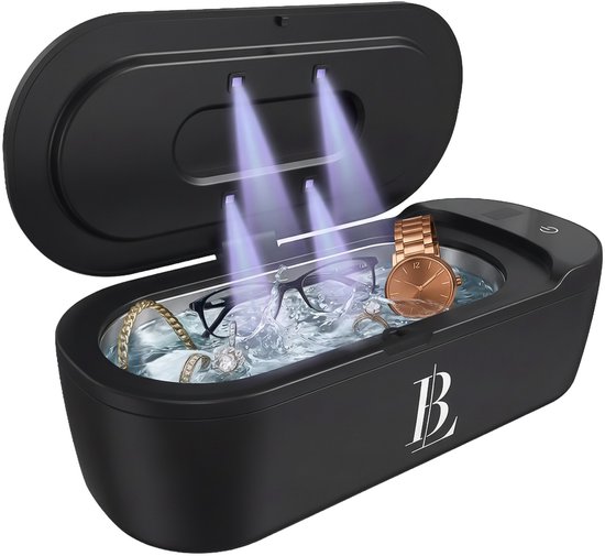 Nettoyeur ultrason noir avec couvercle ouvert, rempli d'eau, avec lunettes, bague, chaîne, montre et lumière UV.