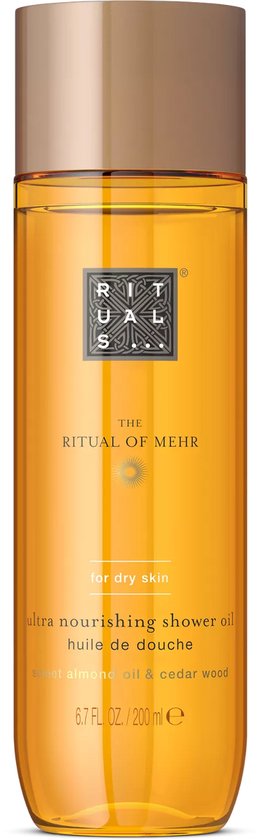 Gouden doucheolie fles met gouden dop. Het etiket is oranje met tekst in het wit en goud.