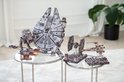 Various Star Wars wooden models including Millennium Falcon, AT-ST, TIE fighter, X-wing.