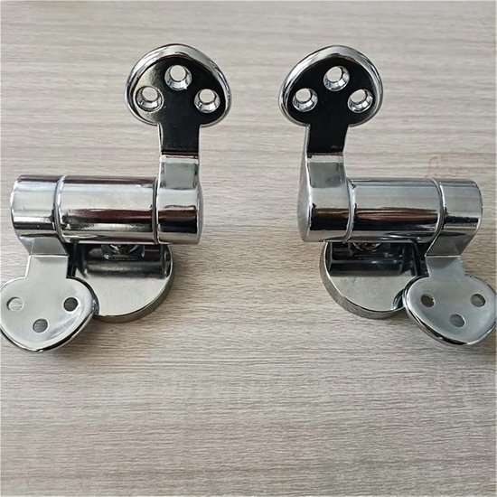 Twee zilverkleurige toiletbril scharnieren met een hartvormige basis en drie gaten.