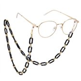 Gouden bril met een zwart montuur, vastgemaakt aan een schakelketting van goudkleurige en zwarte acryl schakels.