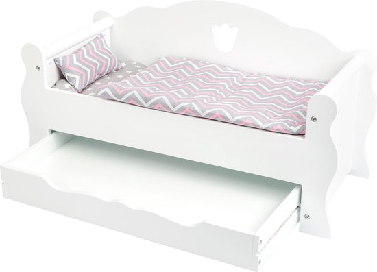 Wit poppenbed met open lade, roze, grijs en wit zigzag dekbed en kussen met sterren.