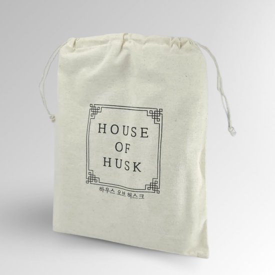 Natuurlijke katoenen zak met de tekst "HOUSE OF HUSK" in het midden.