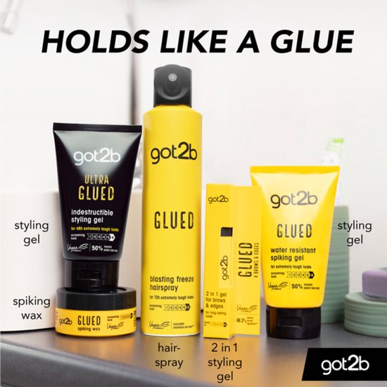 Een assortiment Got2b producten, waaronder de gele "GLUED" haarlak, "ULTRA GLUED" styling gel en "GLUED" wax.