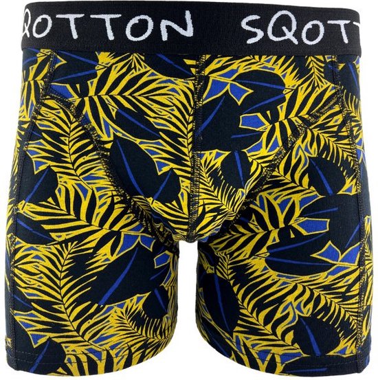 Boxer avec imprimé feuilles de palmier tropical jaune et bleu sur fond noir. Ceinture noire avec logo 'SQOTTON'.