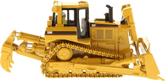 Gele Caterpillar D8R bulldozer met grijper aan de voorzijde, zicht op de zijkant.