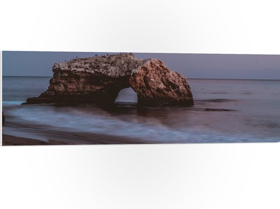 WallClassics - PVC Schuimplaat- Boog van Natuursteen in de Zee - 120x40 cm Foto op PVC Schuimplaat