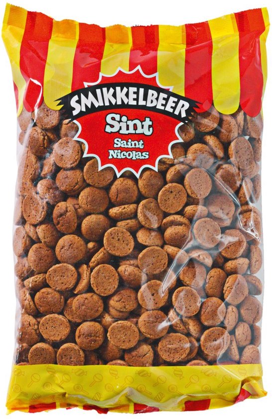 Een zak kruidnoten van 1 kilo met rode en gele strepen. De tekst 'SMIKKELBEER Sint' is zichtbaar.