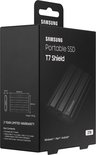 Zwarte Samsung Portable SSD T7 Shield in verpakking, met afmetingen, gewicht, inhoud en compatibiliteitslogo's.