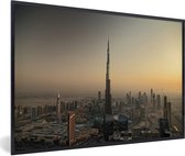 Fotolijst incl. Poster - Zonsondergang achter de Burj Khalifa en Dubai - 120x80 cm - Posterlijst