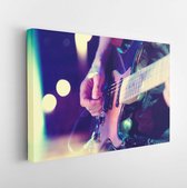 Canvas schilderij - Stage lights.Abstract musical background.Playing guitar and concert concept.Live music background.Music festival.Instrument on stage and band -     570930910 -
