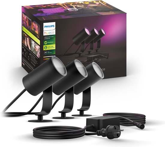 Philips Hue Lily set van 3 spots met doos, voedingskabel en accessoires, op witte achtergrond.
