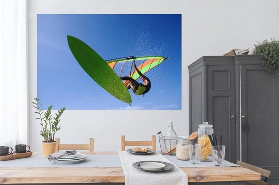 Un véliplanchiste accroche dans les airs Poster 180x120 cm - Tirage photo  sur Poster
