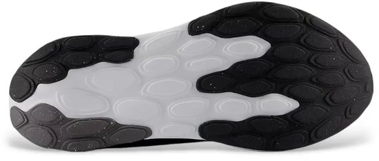 Zool van een zwarte New Balance 520 sportschoen met zwart en wit design.